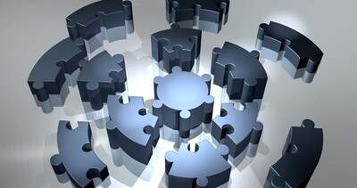 Abstract geometric puzzle pieces fitting together, representing modular system architecture